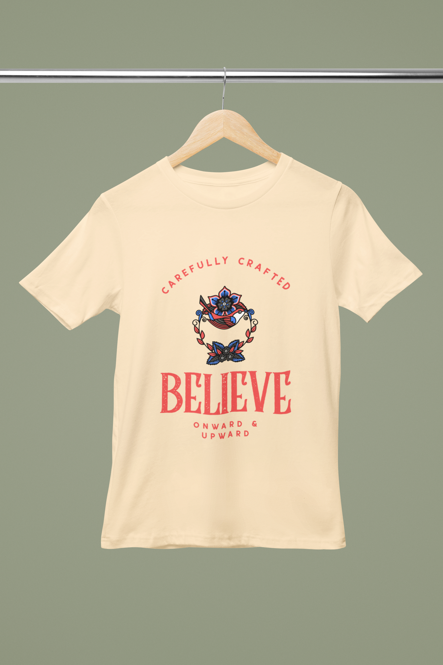 Believe Retro T Shirt on beige cotton crew‑neck tee with bold vintage"Believe" typography graphic FOMO Fashions.