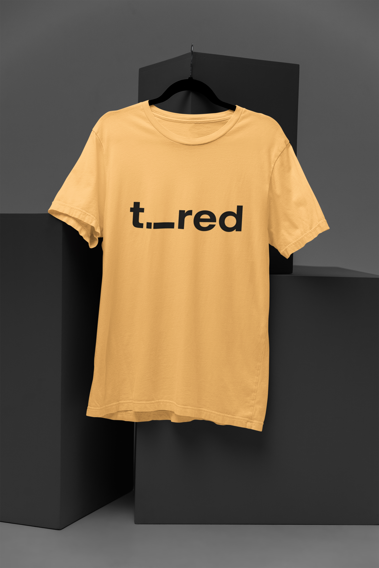 FOMO Fashions Tired T Shirt beige cotton tee with minimalist"Tired" word typography print