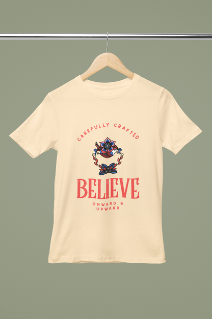 Believe Retro T Shirt on beige cotton crew‑neck tee with bold vintage"Believe" typography graphic FOMO Fashions.
