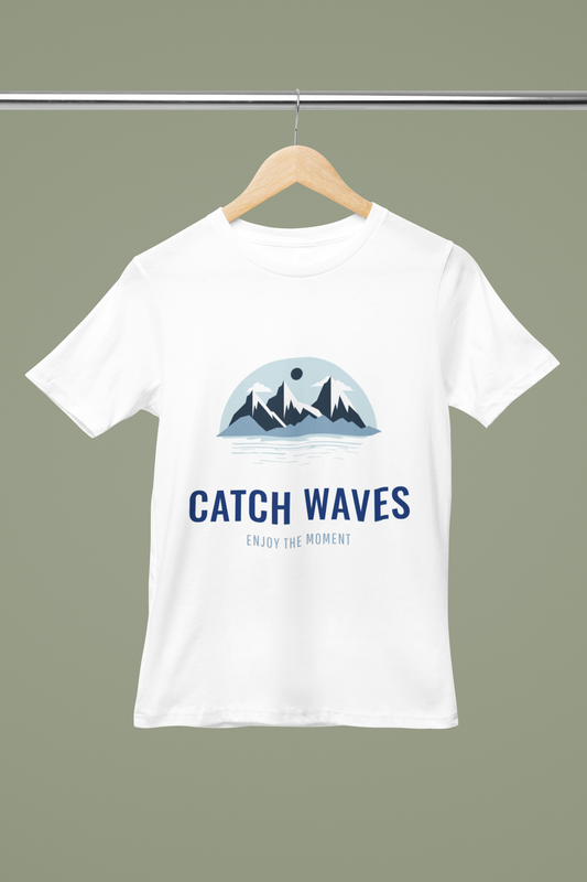 Catch Waves T Shirt mock‑up on white tee with"Catch Waves" surf‑style slogan and coastal font FOMO Fashions.